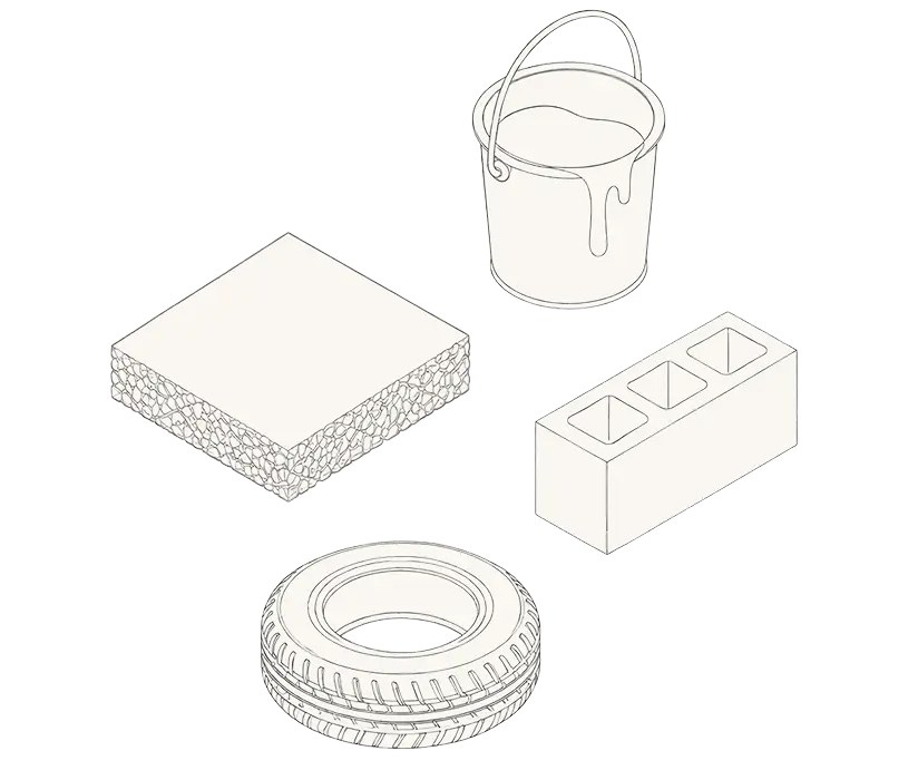 A bucket, a tire, and a bucket of cement arranged on a surface, showcasing various construction materials.